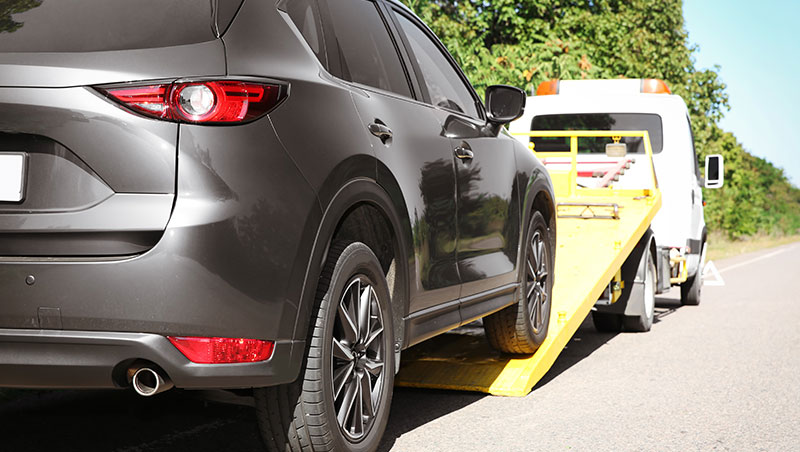 Car getting towed by a Tow Truck